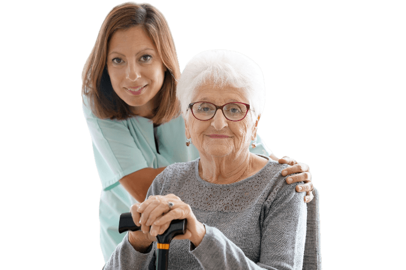 caregiver touching the shoulder of a senior woman in wheelchair