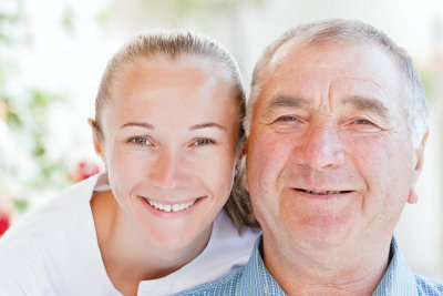 smiling middle aged woman with elderly man