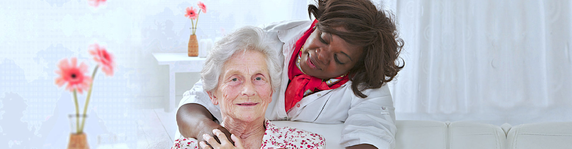 caregiver hugging the elderly woman from behind